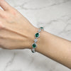 Approx. 8.62 carats Oval Emeralds&nbsp;
3.57 carats Round Diamonds&nbsp;
Bracelet set in 18K White Gold&nbsp;
6.75 in
