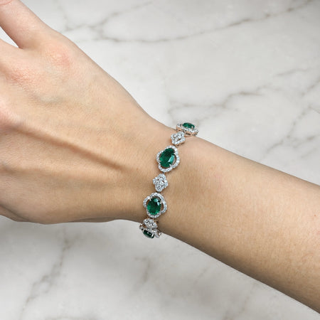 Approx. 8.62 carats Oval Emeralds&nbsp;
3.57 carats Round Diamonds&nbsp;
Bracelet set in 18K White Gold&nbsp;
6.75 in