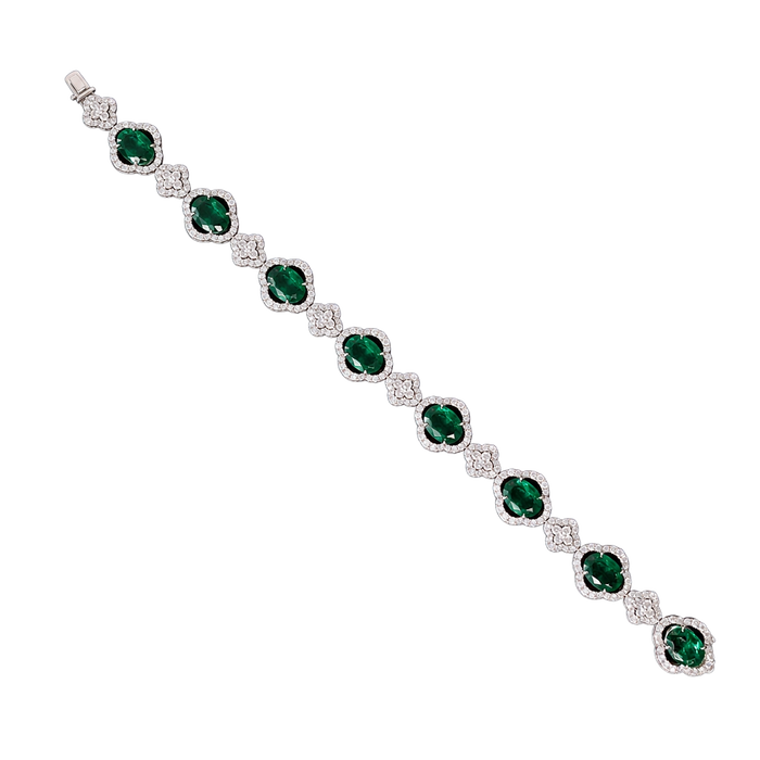 Approx. 8.62 carats Oval Emeralds&nbsp;
3.57 carats Round Diamonds&nbsp;
Bracelet set in 18K White Gold&nbsp;
6.75 in
