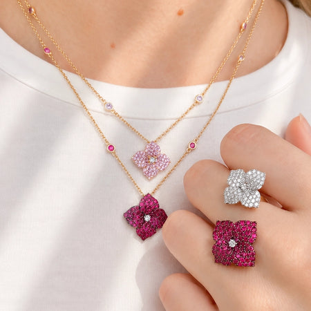 Approx. 1.70 carats Round Pink Sapphires
Diamond Center
Pendant Set in 18K Rose Gold
Color Stone Chain Included
Pendant Measures: 12mm X 12mm
Necklace Measures: 17 inches