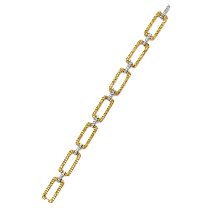 Approx. 4.92 carats Round Orange Sapphires
0.89 carats Round Diamonds

Bracelet set in 18K Yellow Gold