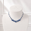 Approx. 15.51 carats Round and Oval Blue Sapphires
1.98 carats Round Diamonds
Set in 18K White and Blackened Gold