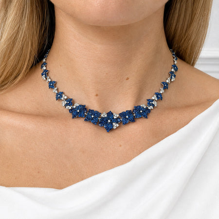 Approx. 15.51 carats Round and Oval Blue Sapphires
1.98 carats Round Diamonds
Set in 18K White and Blackened Gold