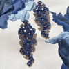 Approx. 16.80 carats Round and Oval Blue Sapphires
0.50 carats Round Diamonds
Set in 18K Yellow, White, and Blackened Gold