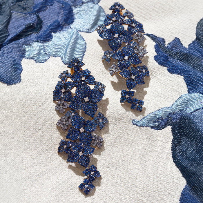 Approx. 16.80 carats Round and Oval Blue Sapphires
0.50 carats Round Diamonds
Set in 18K Yellow, White, and Blackened Gold