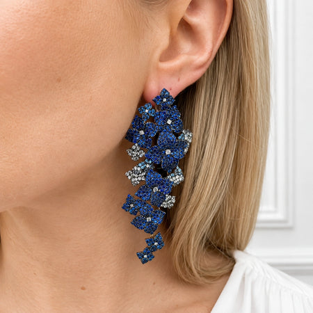 Approx. 16.80 carats Round and Oval Blue Sapphires
0.50 carats Round Diamonds
Set in 18K Yellow, White, and Blackened Gold