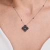 Approx.&nbsp;2.10 carats Round Black Diamonds
White Diamond Center
Pendant Set in 18K White and Black Gold
Color Diamond Chain Included
Pendant Measures: 17mm X 17mm
Necklace Measures: 18 inches