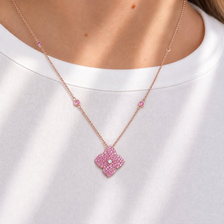 Approx.&nbsp;2.30 carats Round Pink Sapphires
White Diamond Center
Pendant Set in 18K Rose Gold
Color Stone Chain Included
Pendant Measures: 17mm X 17mm
Necklace Measures: 18 inches