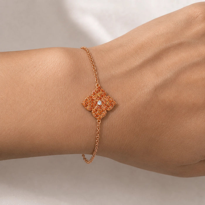 0.94&nbsp;carats Round Orange Sapphire
0.04&nbsp;carats&nbsp;center Round White Diamond
Bracelet&nbsp;Set in 18K Rose Gold
Flower Motif: 12mm X 12mm
Bracelet Length 6.75