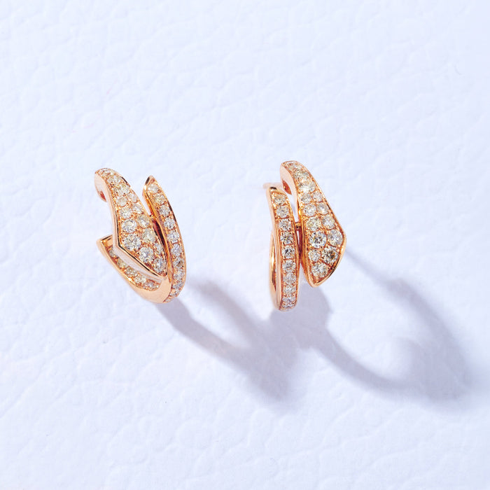Approx. 0.85 carats of round diamonds
Earring is set in 18K Rose Gold
For pierced ears