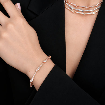 Approx. 2.20 carats of round diamonds
Bracelet is set in 18K Rose Gold

Measures 6.75 inches in length