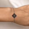 0.86 carats Round Black Diamonds
0.04 carats&nbsp;Center Round White Diamond
Bracelet&nbsp;Set in 18K White Gold
Flower Motif: 12mm X 12mm
Bracelet Length 6.75 inches