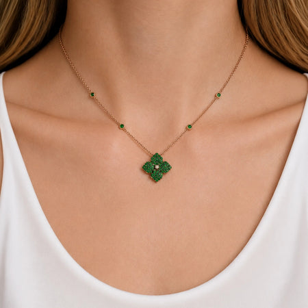 Approx. 1.60 carats Round Green Tsavorite
Diamond Center
Pendant Set in 18K Yellow and Black Gold
Color Stone Chain Included
Pendant Measures: 12mm X 12mm
Necklace Measures: 17 inches