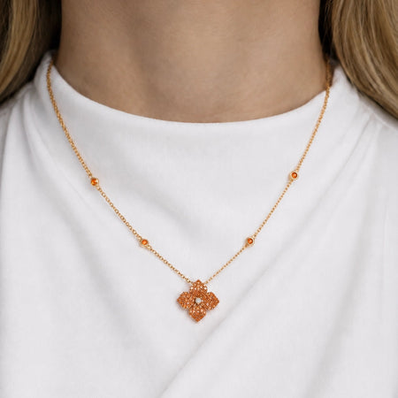 Approx. 1.70 carats Round&nbsp;Orange Sapphires
Diamond Center
Pendant Set in 18K Rose Gold
Color Stone Chain Included
Pendant Measures: 12mm X 12mm
Necklace Measures: 17 inches