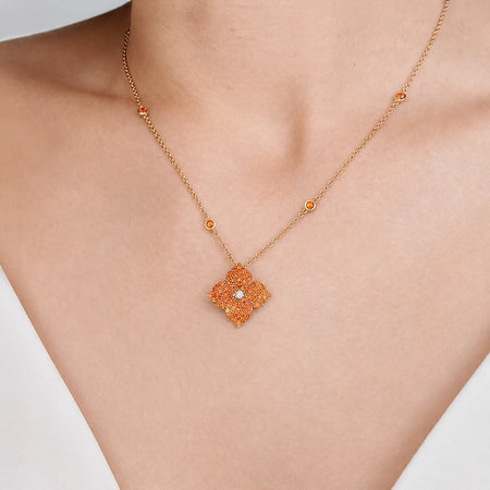 Approx.&nbsp;2.50 carats Round Orange Sapphires
White Diamond Center
Pendant Set in 18K Rose Gold
Color Stone Chain Included
Pendant Measures: 17mm X 17mm
Necklace Measures: 18 inches