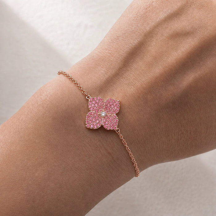 1.02 carats Round Pink Sapphire
0.04 carats center Round White Diamond
Bracelet&nbsp;Set in 18K Rose&nbsp;Gold
Flower Motif: 12mm X 12mm
Bracelet Length 6.75&nbsp;Inches
