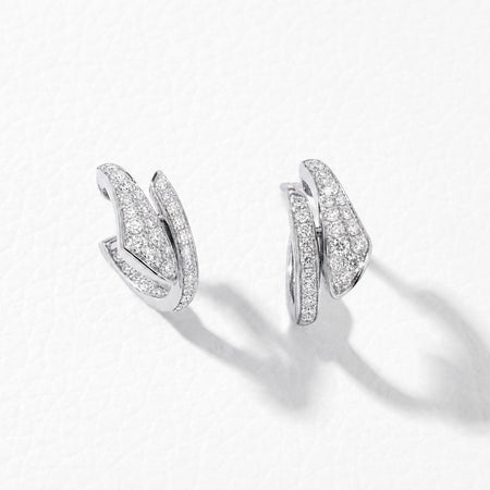 Approx. 0.85 carats of round diamonds
Earring is set in 18K White Gold
For pierced ears
