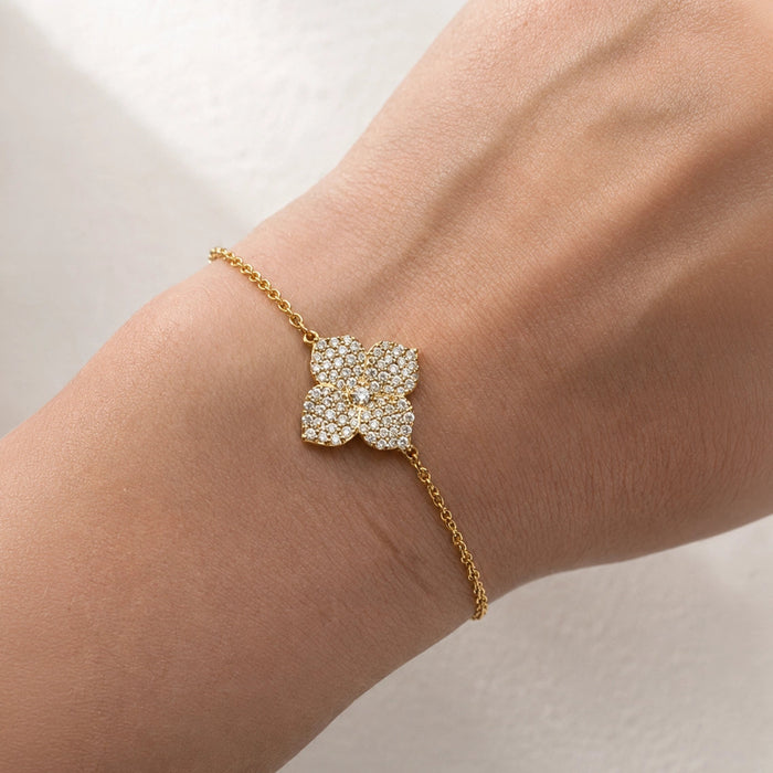 0.79&nbsp;carats Round White Diamonds
Flower Motif: 12mm X 12mm
Bracelet Set in 18K Yellow Gold
Bracelet Length 6.5&nbsp;Inches