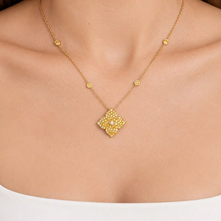 Approx.&nbsp;2.50 carats Round Yellow Sapphires
White Diamond Center
Pendant Set in 18K Yellow Gold
Color Stone Chain Included
Pendant Measures: 17mm X 17mm
Necklace Measures: 18 inches