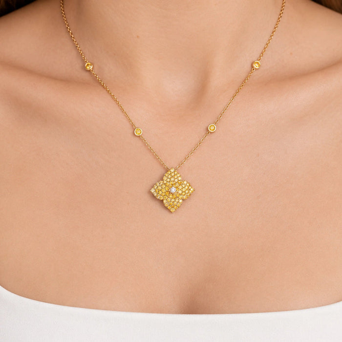 Approx.&nbsp;2.50 carats Round Yellow Sapphires
White Diamond Center
Pendant Set in 18K Yellow Gold
Color Stone Chain Included
Pendant Measures: 17mm X 17mm
Necklace Measures: 18 inches